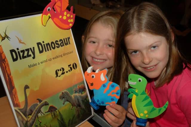 Sisters Scarlett and Holly Measures get set to go dinosaur racing PHOTO: Tim Williams