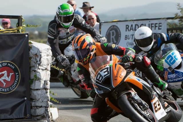 Ben leads rival rriders through a typical Isle of Man race scene EMN-170727-120901002
