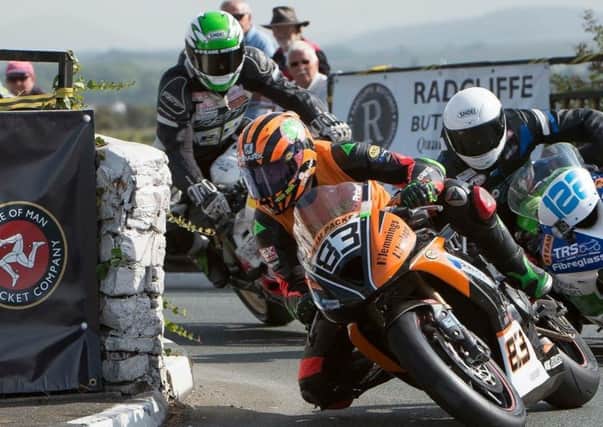 Ben leads rival rriders through a typical Isle of Man race scene EMN-170727-120901002