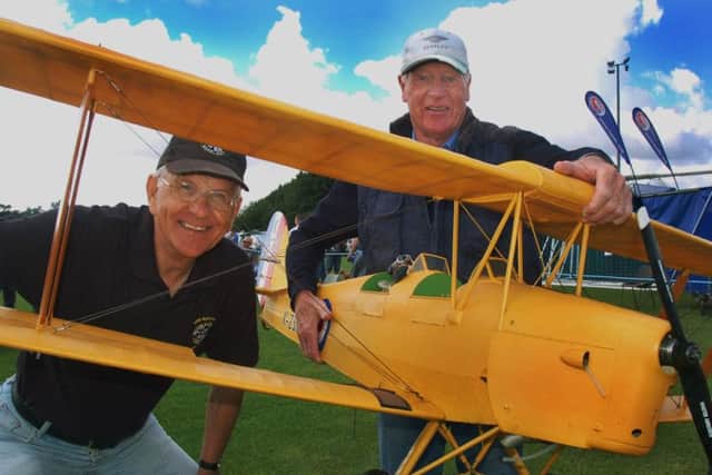 Mick Butler (right) proudly displays his quarter-scale model Tiger Moth with Trevor Main PHOTO: Tim Williams