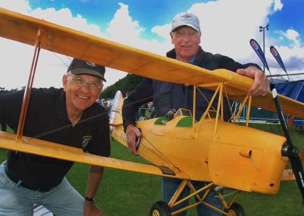 Mick Butler (right) proudly displays his quarter-scale model Tiger Moth with Trevor Main PHOTO: Tim Williams
