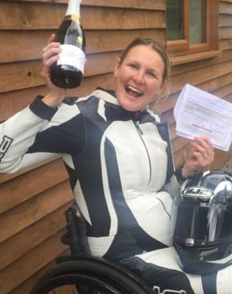 Claire Lomas celebrates attaining her motorbike racing licence EMN-170728-161941001