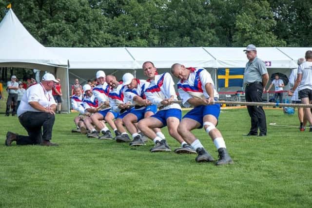 Tim runs the rule over the Lincoln tug of war team during a match at the World Games EMN-170208-112802002