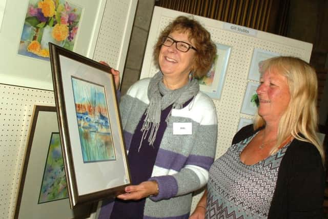 Ann Head shows Janet Hall some of her work PHOTO: Tim Williams