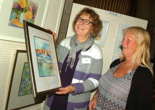 Ann Head shows Janet Hall some of her work PHOTO: Tim Williams