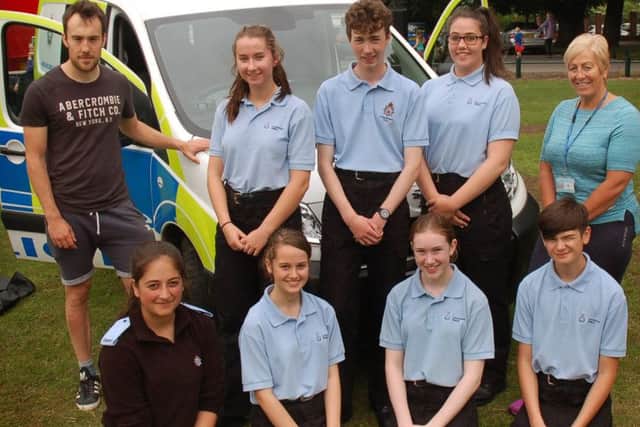 The Police Cadets pictured with cadet leaders Oliver Wood and Andrea Kemp were on hand to meet and greet children PHOTO: Tim Williams