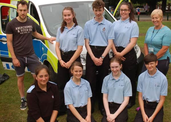 The Police Cadets pictured with cadet leaders Oliver Wood and Andrea Kemp were on hand to meet and greet children PHOTO: Tim Williams