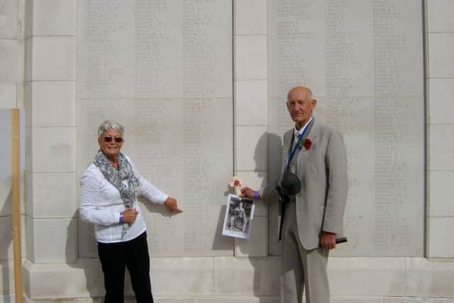 Geoff and Judy Goodson pictured at the memorial wall at the Tyne Cot military cemetery - his father's cousin, Thomas Bernard Goodson, is listed on the wall as one of 34,000 with no known grave after he was killed during the Battle of Passchendaele during the First World War EMN-170908-145905001