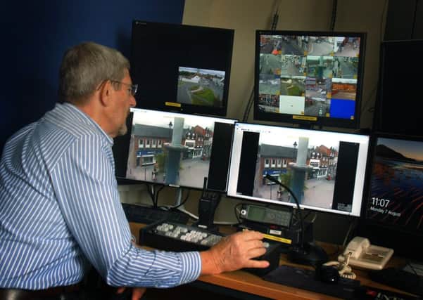 Roger Petchey, lead volunteer for Melton police, monitors live CCTV footage of the town centre streets on his banks of screens EMN-170708-162138001