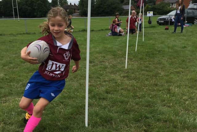 Youngsters try out a fun drill at last year's Try Rugby day EMN-170808-172233002