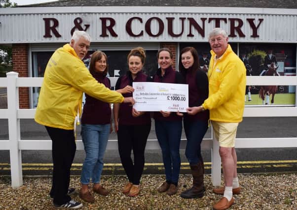 Cheque being donated to Air Ambulance volunteers (left to right): Ian Evans, Gemma Knott, Bryony Allen, Wendy Beal, Sadie Ellis and John Nowell PHOTO: Supplied
