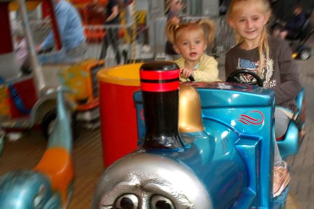 Olivia Frost and Scarlett Manship enjoy a carousel ride PHOTO: Tim Williams