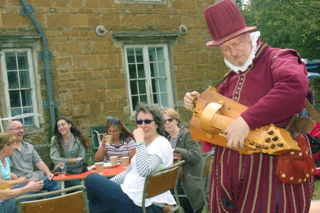 Hurdy-Gurdy man Paul Baker provides some medieval minstrel accompaniment PHOTO: Tim Williams