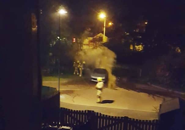 A car on fire in Drummond Walk, Melton, after being attacked by an arsonist. PHOTO by Sarah Criddle EMN-170814-095231001
