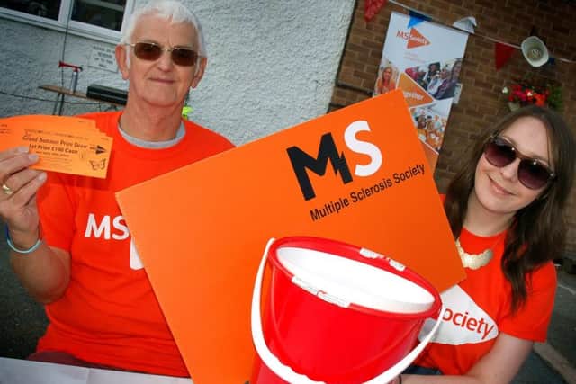 MS Society coordinators Peter Smith and Zoe Handley on registration duty PHOTO: Tim Williams