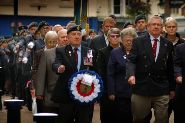 Members of Melton's Royal British Legion branch march down High Street during the Battle of Britain parade EMN-170918-101847001