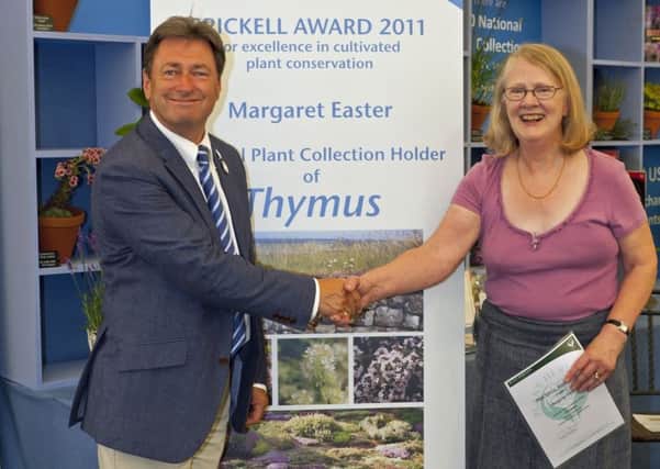Margaret Easter receiving the Brickell Award for Excellence in Cultivated Plant Conservation with gardening icon and Plant Heritage president, Alan Titchmarsh PHOTO: Tim Easter