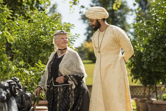 Dame Judi Dench as Queen Victoria and Ali Fazal as Abdul Karim PHOTO: PA Photo/Focus Features/Peter Mountain