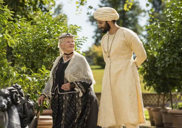 Dame Judi Dench as Queen Victoria and Ali Fazal as Abdul Karim PHOTO: PA Photo/Focus Features/Peter Mountain
