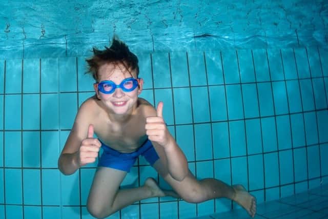 A boy who took part in the Duchenne Dip rundraiser at Melton is captured underwater by photographer Pash Baker EMN-170926-125317001