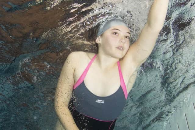 A girl powers through the water during the Duchenne Dip rundraiser at Melton. Photo by Saeed Rashid EMN-170926-125404001
