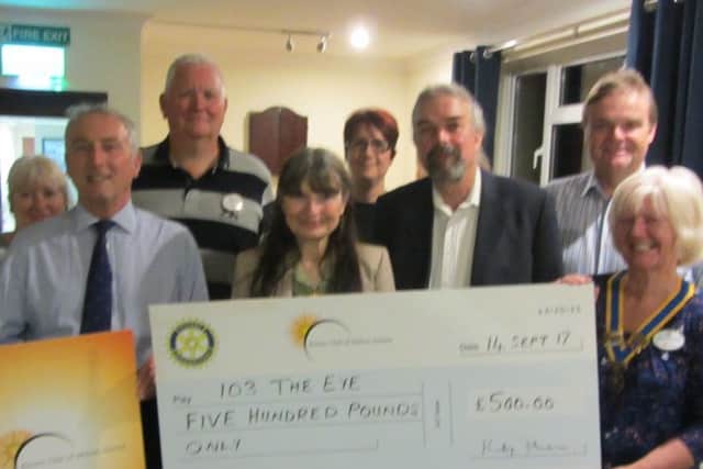Aurora Rotarians present a cheque for £500 to 103 The Eye PHOTO: Supplied