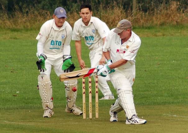 Barkby's John Pook sweeps, watched by wicket-keeper Chris Holland. EMN-170927-130121002
