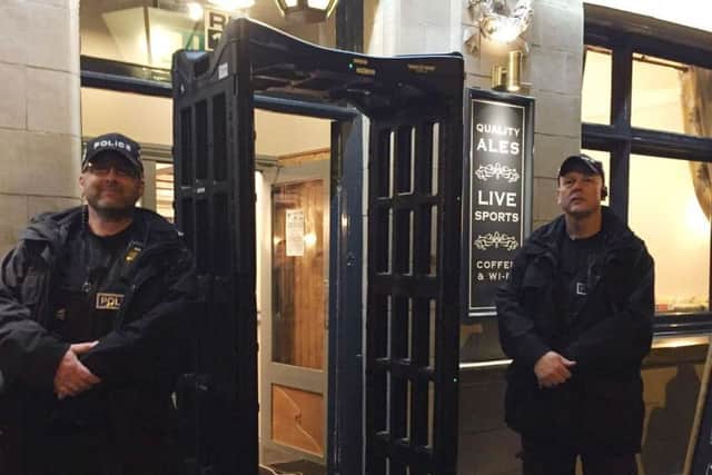 Police officers with a knife arch metal-detector outside the Black Swan pub in Melton which was deployed as part of an operation to raise awareness about the dangers of carrying knives EMN-170910-101209001