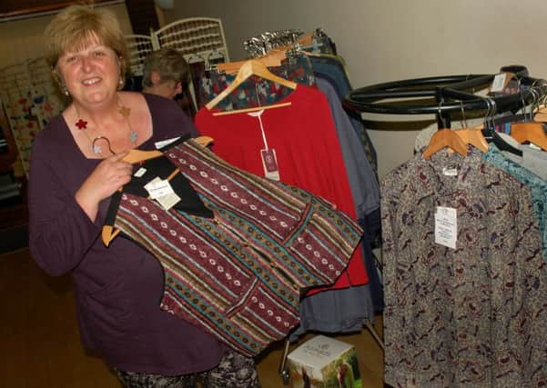 Fairtrading Post director Helen Chadwick with clothing PHOTO: Tim Williams