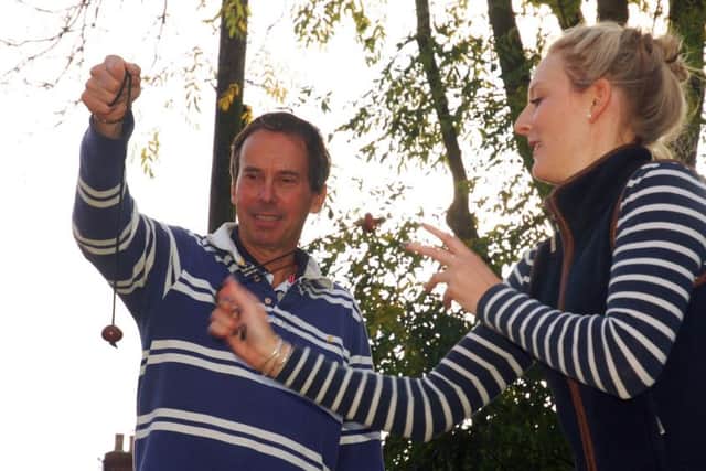 Paul Girdham and Helen Lovegrove do battle in the adult's final PHOTO: Tim Williams