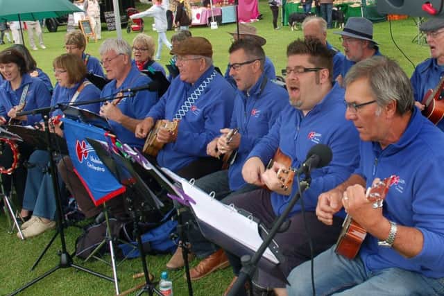 Melstrum entertain with their ukuleles PHOTO: Tim Williams