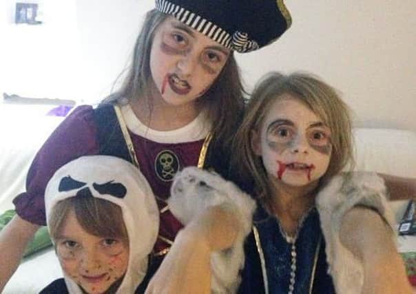 Booooo! Imogen, Millie and Louis Whitehouse all dressed up in scary wear PHOTO: Supplied
