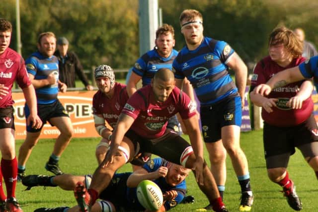 Kieran Bugby gathers the loose ball as Melton come under pressure at Syston EMN-171017-170844002