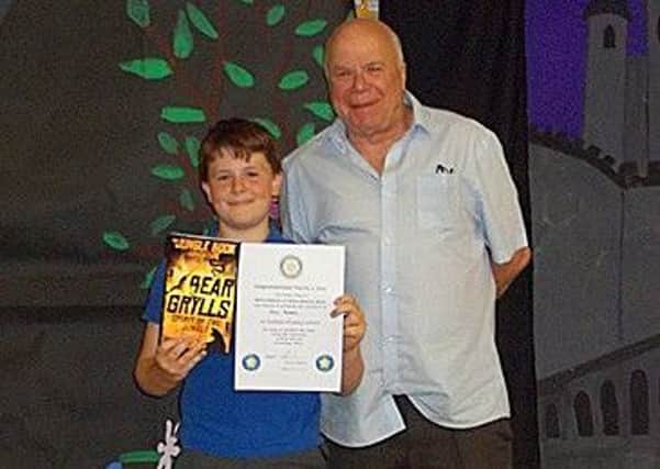 Max Green of Ab Kettleby Primary School being presented his Rotary Star Award from Rotarian Tony Pick PHOTO: Supplied