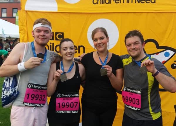 At the finish with their medals - (Left to right): Jon Baines, Rebecca Baines, Laura Bedson and Tom Baines PHOTO: Supplied