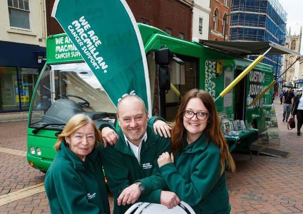 From left Margaret Watts (information specialist), Jeremy Burman (facilities officer) and Moray Hayman (information specialist) with Betty, the Macmillan mobile information bus