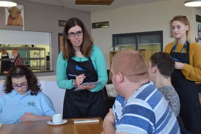 Sophie Garfoot (green jumper) taking orders from the Birch Wood School sixth form students PHOTO: Supplied