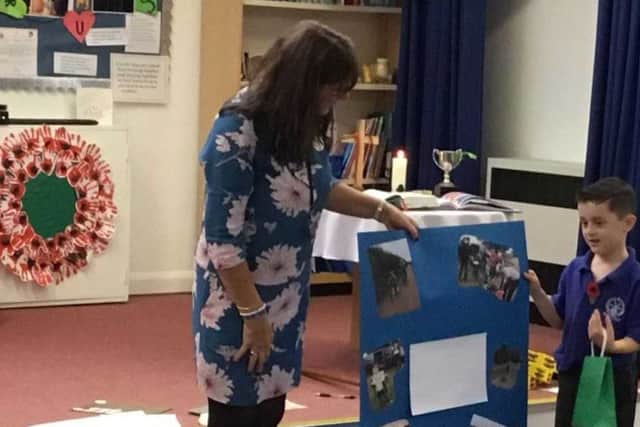Louie talking about his bike ride round Rutland Water in school assembly PHOTO: Supplied