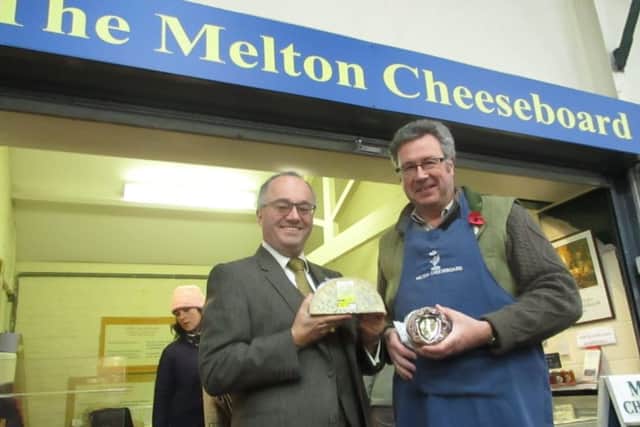 Rupert Matthews MEP visits the Melton Cheeseboard stall at the town's livestock market and chats with the business' shop owner, Tim Brown EMN-170611-101458001