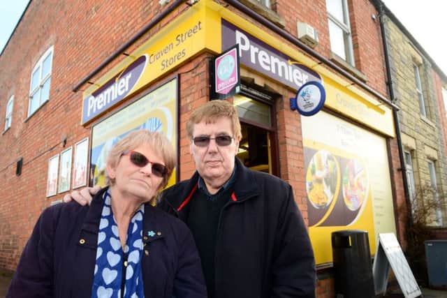 LH2222-04 : ©Lionel Heap : Melton News : Craven Street Stores Axe Robbery : Ann and Richard Sage outside their Craven Street shop. Ann was attacked by the axe wielding robber and needed hospital treatment. EMN-171117-145323001