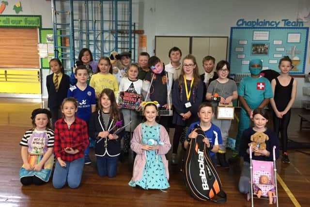 Children at St Francis paid Â£1 to dress up as what they'd like to be when they grow up. Staff also got into the spirit of the day and dressed up, not as teachers, but artists, hairdressers and chefs. Some of the school's Year 6 girls also baked and sold cakes. The school raised Â£259 PHOTO: Supplied